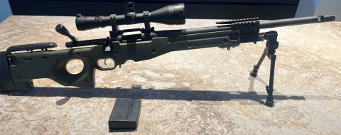 Remington 700 Tactical rifle with heavy barrel and muzzle brake. Fitted with 10 shot detachable magazine and AI tactical stock with additional picatinny fore en