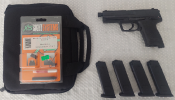 Heckler & Koch USP 9mm with 4x Ten round magazines. Also included is a padded case and Tritium sights that haven't been installed yet.