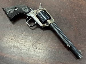 COLT
SAA "PEACEMAKER 22"
22 WMR
6 SHOT
6 INCH BARREL
COLOR CASE FINISHED FRAME 
COLT HARTFORD ADDRESS ON BARREL
ORIGINAL BLACK CHECKERED GRIPS
MANUFACTURED 1976
VERY RARE 
#G175028

VGC+ $1390