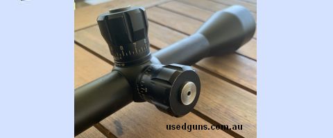 Very clear bushnell fixed 10x40 large target turrets with strong adjustments very clear glass very nice scope also have a 6-24 x40 bushnell rainguard target sco