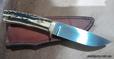 Vintage Australian hand made "Bidgood" hunting knife and leather belt sheath antler grip. No cracks or splits. Overall length is 8.5 inches. Loveless drop point