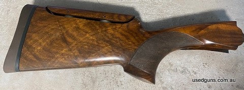 Beretta DT10 Trap Right Handed Stock with adjustable comb. Good condition no cracks or scratches, a few dents but overall nice timber. Includes stock bolt and a
