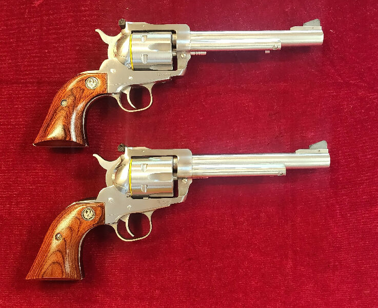 NEW PAIR OF CONSECUTIVE NUMBERED RUGER BLACKHAWKS IN 357M STAINLESS STEEL MODEL. 6 1/2" BARREL, WALNUT GRIPS, AVAILABLE NOW.
