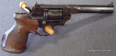 Older model ringle action Russian pistol with target grips. A bit of pitting about the gun. Stock number 6495
