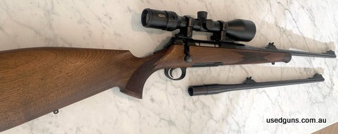 Roessler an Austrian custom rifle maker switch barrel 9.3x62 plus 30-06 both barrels have open sights nice dark walnut stock, protective stock cover for hunting