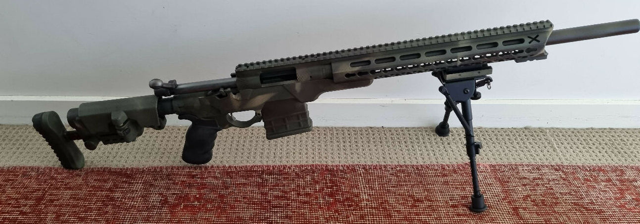 Remington 700 chambered in .223, Varmint barrel, rail etc