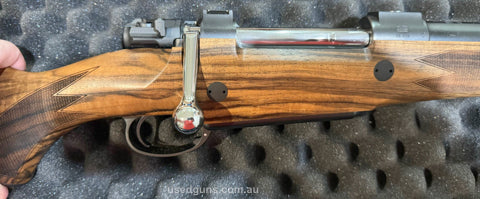 Brand new Mauser M98 Diplomat rifle in 416 Rigby. Double square bridge magnum length action with highly figured Grade 7 walnut stock. Comes with its original ca
