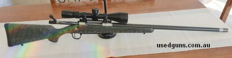 Christensen 300WM Ridgeline. Carbon wrapped stainless steel barrel with muzzle brake at 26 inches, Carbon stock green with black spider webbing. This is 12 mont