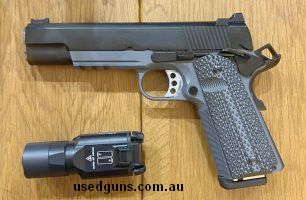 Gun in very good condition. includes Surefire weapon light and holster. Fires without fault every time, except for a bad primer. good groupings. Barrel in very 