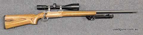 A Ruger M77 Mark II in 22-250 in very good condition. This rifle has a heavy barrel and laminated timber stock. This rifle comes with a Bushnell Elite 4-16x50 s