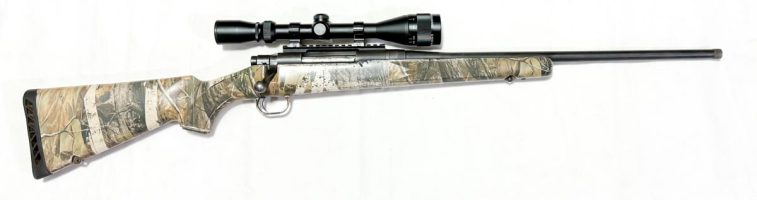 Looking for a big-game bargain? This Mossberg is in sound condition throughout but is a bit rough around the edges: the bluing is faded, the camo stock is losin