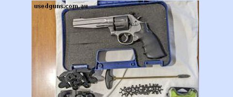 S&W 9mm, 7 shot revolver. hardly used, sale includes all items shown including 16 moon clips, 2 belt clip holders, holster, carry case, owners manual, gun keys,