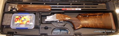 Gun comes with 4 Chokes in hard case. Small mark in stock on right side of tang.