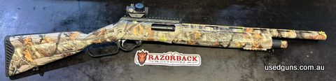 As new unfired Adler A110 Camo 20", has Bushnell AK optics 1x25 red dot, Picatinny rail and Lucky 13 shell saddle on left side