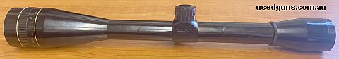 Leupold 24X Target Scope with winf Target Reticle. Has a 25mm tube, capped target turrets, gloss finish that is showing some signs of discoloration. Comes with 