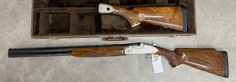 28 inch barrel , monte carlo trap stock and comes with additional sporting stock (scratch mark on it). does not come with the case - it has a regular rifle bag 