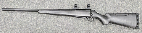 A custom Left hand Tikka T3x in 30-06 in excellent condition. This rifle has been custom built with a carbon wrapped barrel and carbon stock. Comes with 1" Tall