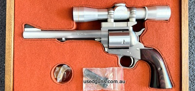 As new Freedom Arms Model 83 Presentation Grade with 7 1/2 inch barrel chambered in 454 Casull. Complete with scope mount, Leupold M8 4x long eye relief pistol 