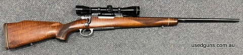 Zastava M98 with factory engraving and high grade stock in 270 win. 24" barrel. Engraved action, bolt and floor plate. Would be excellent except for a couple of