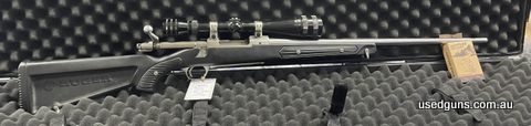 Ruger M77 Paddle Stock, very good condition, M77 mounts with a redfield 6-18X scope.