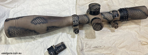Reticule is what I would call mill dot, scope was Cerakote to match the rifle at the time, scope was removed for sale of the rifle, a few marks on the Cerakote 