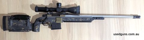 Howa 1500 chambered in 6.5 Creedmoor in a KRG Bravo that has been professionally cerakoted a custom Multicam type pattern. The action has been cerakoted burnt b