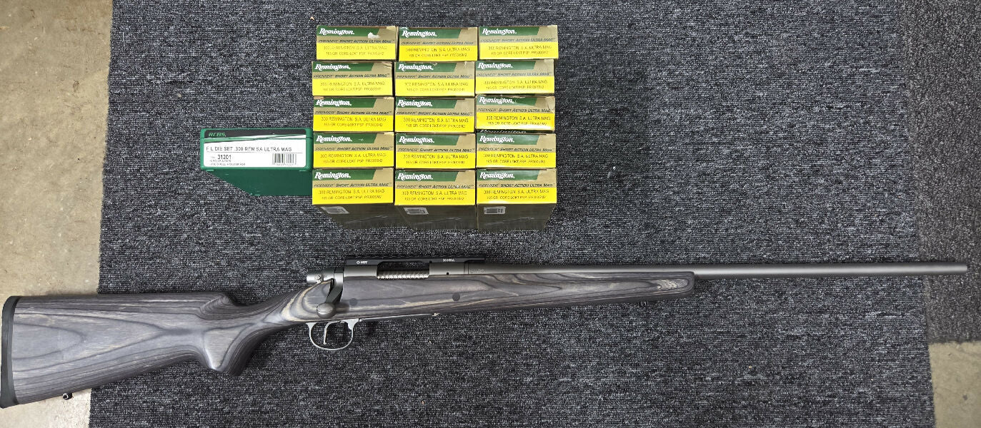 Remington 700 stainless in 300 SAUM with 24" barrel. Comes fitted with a Trigger Tech Special flat face trigger with safety and bolt release, Boyd laminate stoc