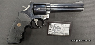 Clean 586 with rubber grips, shipping extra.
