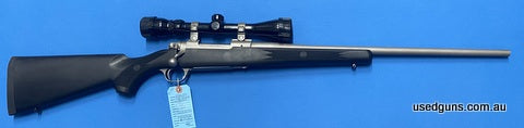 Ruger M77 in 243W. Has a Tasco World Class 3-9x40 scope mounted. Great all weather rugged Ruger rifle.