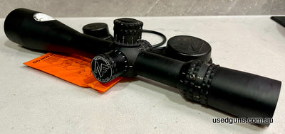NightForce NXS 3.5-15x50 with MIL R illuminated reticle in Second Focal Plane. Had limited use at range and long range hunter. Light paint rubbing marks on plac