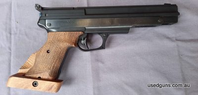Minor wear on bluing, but in excellent working condition. Custom made grip.