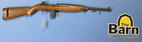 Plainfield Machine M1 carbine. Heat shield in place. A few cosmetic marks but is in very good condition.