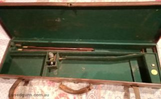 English Gun Case. Leather covered. Brass corners. Excllent condition. For side by side double barrel shotgun.