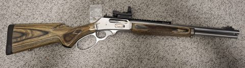 Minimal use but dose have slight pitting at the end of the barrel photo on request comes with red dot.