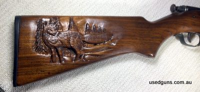 Joe Sharman hand carved original Fox scene on single shot Winchester 67A.