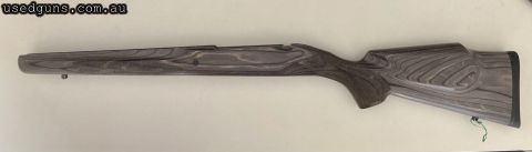 Pepper laminate hardwood stock. Unusually this stock has checkering on the pistol grip and forend. Raised cheek comb allows benefits of a firm cheek weld as wel