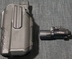 Selling a Genuine Surefire X300A in very good condition along with a Blackhawk Omnivore designed for the Surefire X300 fitted with a Safariland QLS holster atta