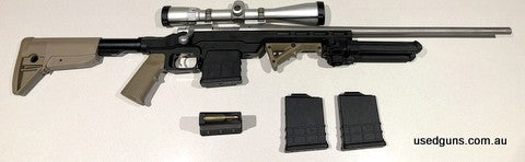 Stainless Remington 700 RH short action in MDT LSS Gen 2 chassis. Stainless Krieger barrel with 223 Remington match chamber. Bolt stop has been moved back and c