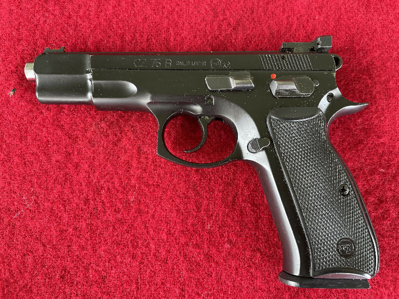 CZ 75B Omega pistol in 9mm. Hard to come by classic, with fibre-optic sights, 5 mags, speed loader, 2 holsters and double mag pouch. In very good condition. An 