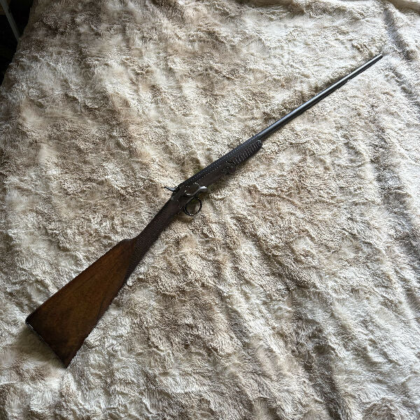 Belgium made .410 collapsible single barrel shotgun. Locks up tight, sturdy design. Listing as good only due to firearm's age.