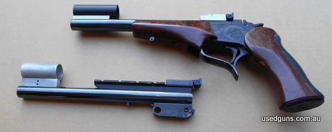 two interchangeable barrels come with this gun 22LR and 38 / 357 Mag. Blued finish. A scope rail is fitted to one barrel and both barrels have shrouded foresigh