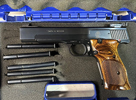 Comes cased with 6 magazines, includes postage fee.