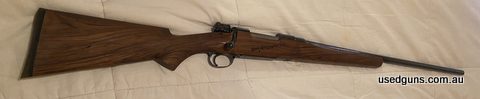 Mark X Commercial. Near new action. Hardly fired. This project rifle has been in the safe for over 20 years. Beautiful wood grain and bedded stock that needs fi