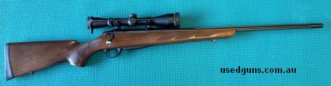 Tikka T3 Hunter with fluted blued barrel, nice looking walnut stock, original Tikka factory scope rings, Leupold VX2 2.4-12x40 scope. Presents as new, great lig