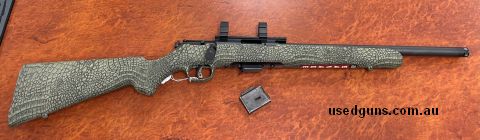 Used Savage 93 22WMR Bolt action Rifle . In good condition. . Synthetic Croc finished stock , blued finish . Rail comes as standard , and with set of inch rings