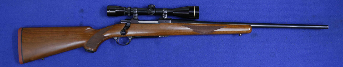 Ruger M77 243 win, timber stock. hinged floor plate, internal magazine 4 shot, blue sporter barrel. Leupold 4-12x40, minor handling dings on stock.