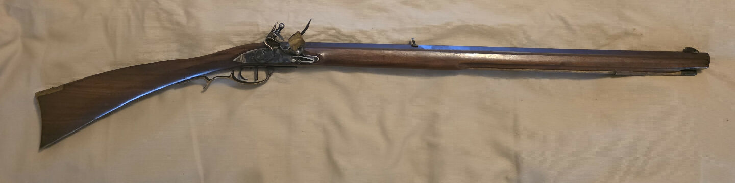 A Pedersoli frontier carbine in 54 cal. Beautiful, well-balanced gun. shorter version of the frontier long-rifle. a 1:66 twist barrel for patched round-ball. Do