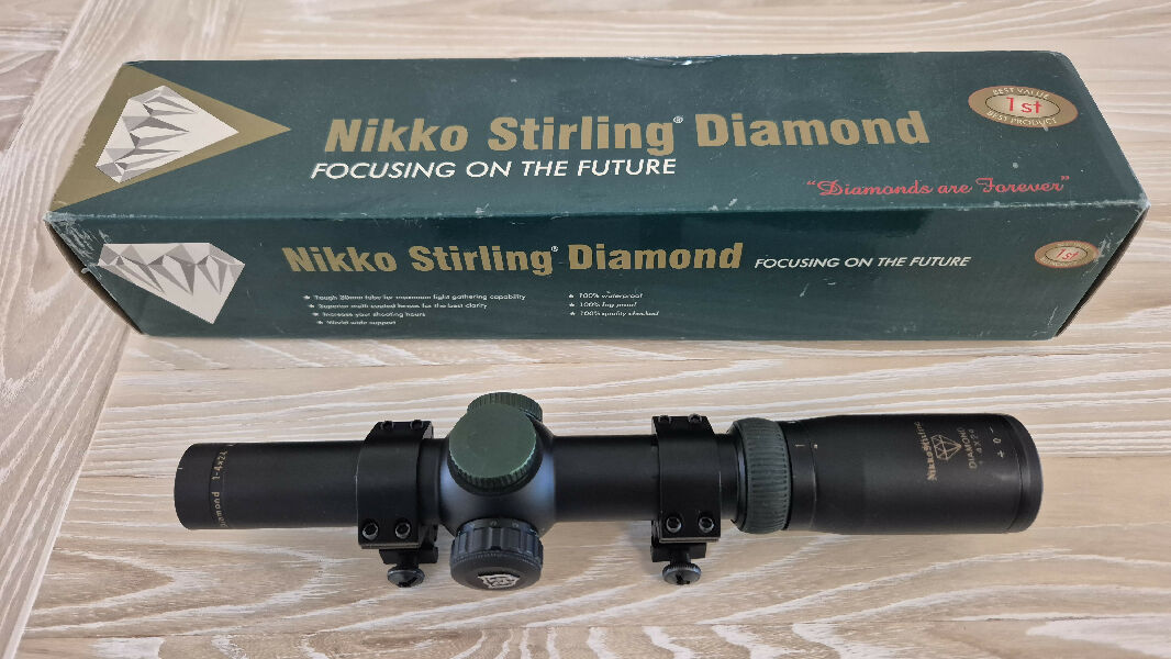 Nikko Sterling Diamond 1-4x24 SFP scope. 30mm tube with No. 4 dot reticle and weaver style rings, unsure of brand.