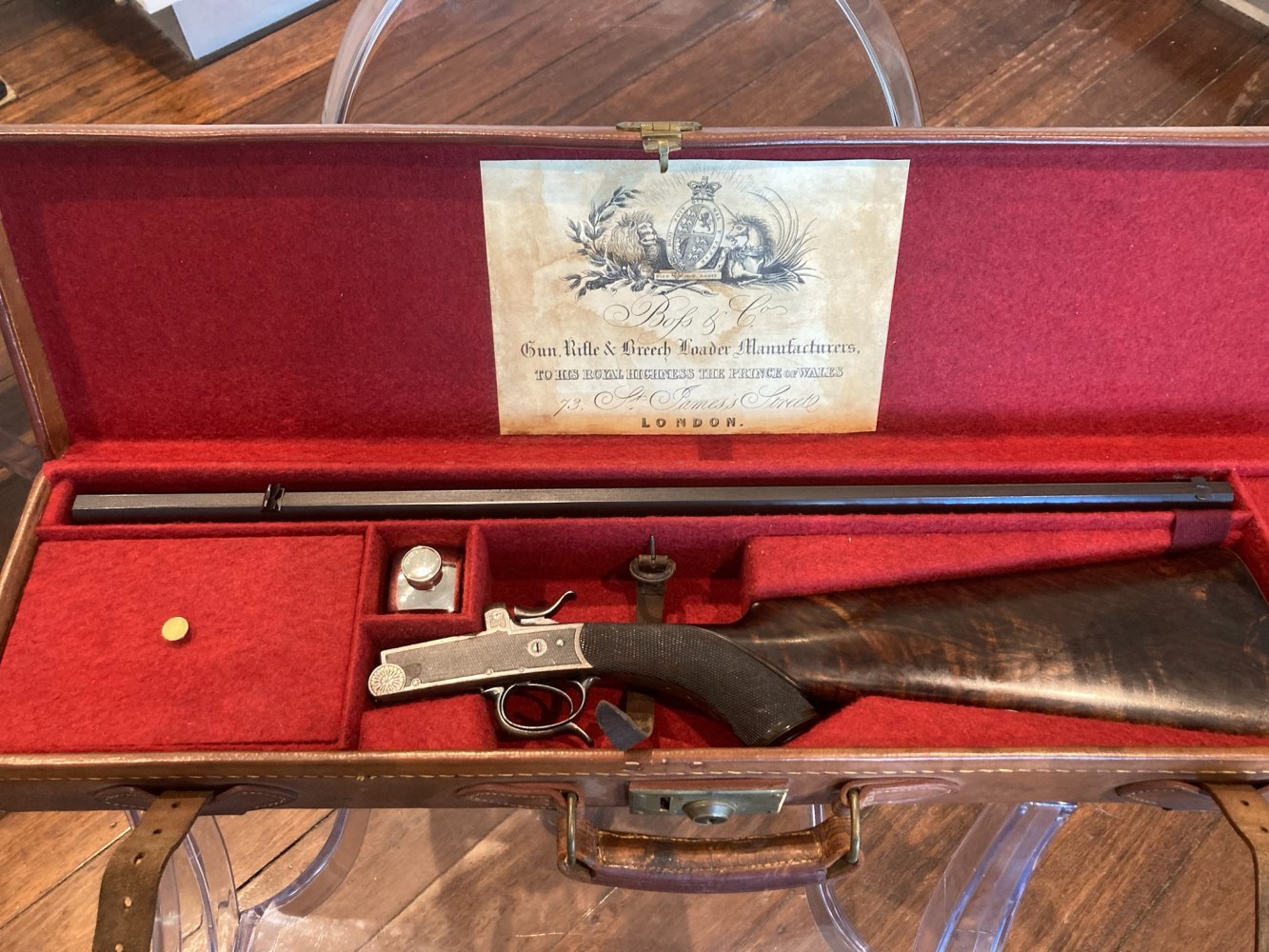 BOSS & CO,” 295 CALIBRE, BLACK POWDER, SINGLE SHOT “ROOK” RIFLE, CIRCA 1895, SERIAL NUMBER 8394. MINT CONDITION, CASED WITH TRADE LABEL AND SYMPATHETICALLY ADDED, MATCHING ENGLISH ACCESSORIES. ORIGINAL, CAME FROM A 50 YEAR COLLECTION, HARDLY FIRED.