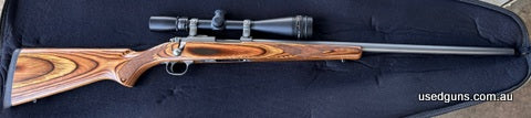 Ruger stainless varmint with laminate stock in 22 Hornet 7 shot rotary mag stainless Ruger rings. Sightron 6.5-20x50 with duplex reticle excellent condition pri